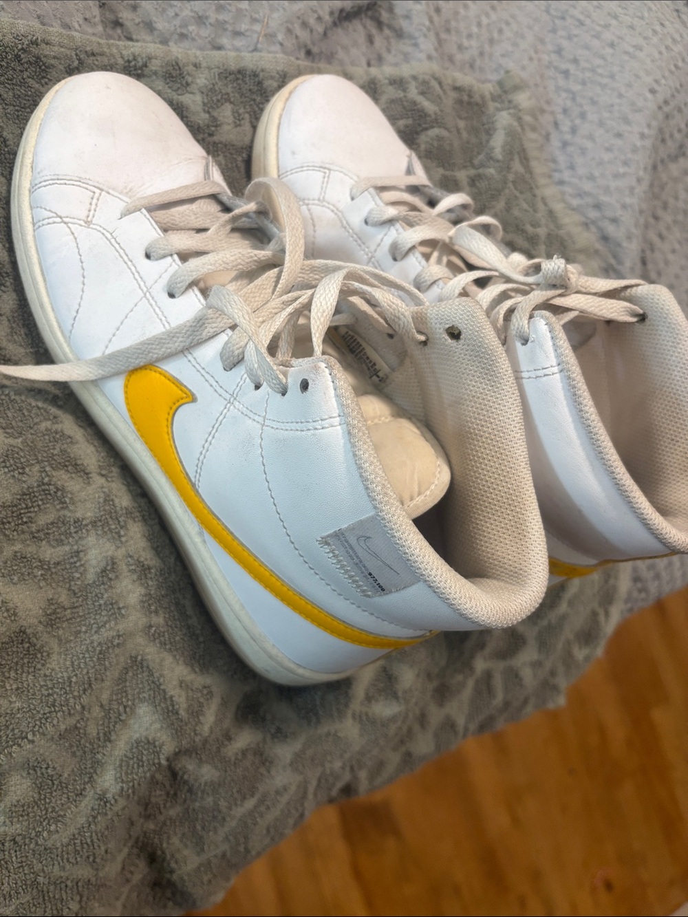 Nike Women’s White High-Top Sneakers with Yellow Swoosh